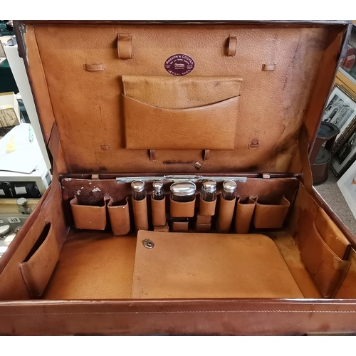 42 - An early 20th Century tan leather suitcase with fitted interior by Robson & Cooper, Bag and Trunk Ma... 