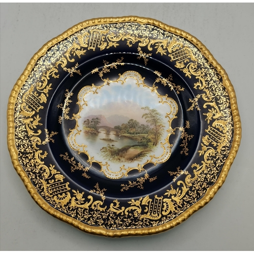 53 - A Coalport cabinet plate, painted with a landscape scene of Weir Bridge, titled verso, within a coba... 