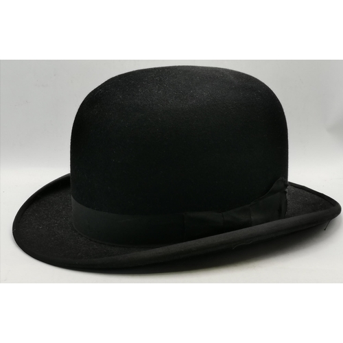 57 - A top hat by WOODROW PICCADILLY LONDON 55.5CM DIAMETER, plus a bowler hat plus a ebonised walking st... 