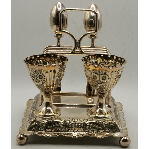 301 - A late Victorian silver-plated egg cruet by Alfred Browett, Birmingham, the stepped square base with... 