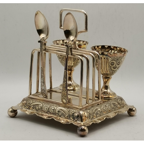 301 - A late Victorian silver-plated egg cruet by Alfred Browett, Birmingham, the stepped square base with... 