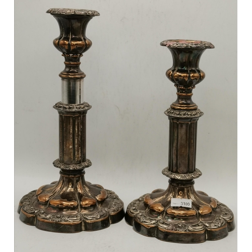 302 - A pair of Old Sheffield Plate extending candlesticks, unmarked, each fluted stem with campana-shaped... 