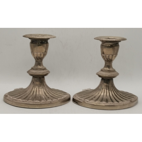 302 - A pair of Old Sheffield Plate extending candlesticks, unmarked, each fluted stem with campana-shaped... 