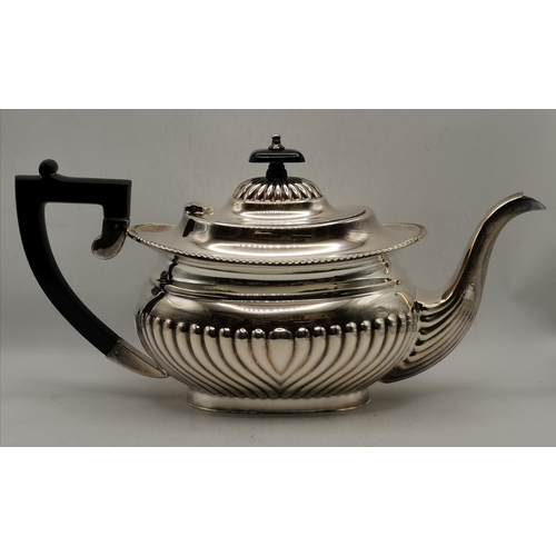 313 - A silver-plated four-piece tea and coffee service comprising teapot, coffee pot, cream and twin-hand... 