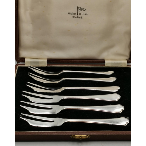 325 - A collection of silver and silver-plated flatware, comprising a set of six George V silver side kniv... 