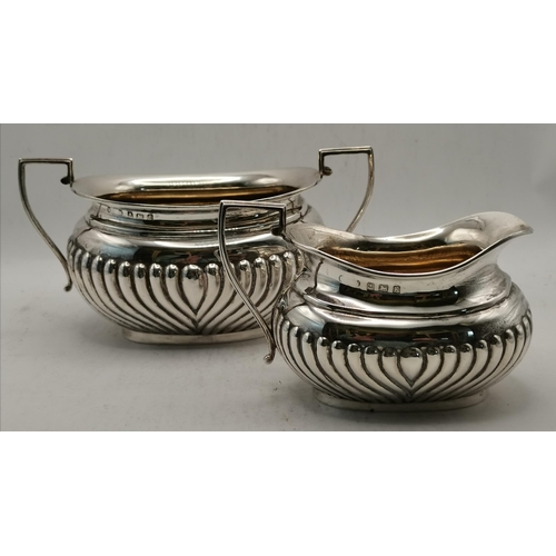 335 - An Edwardian silver four-piece tea service by Keight & Newman, Birmingham 1906, comprising teapot, h... 