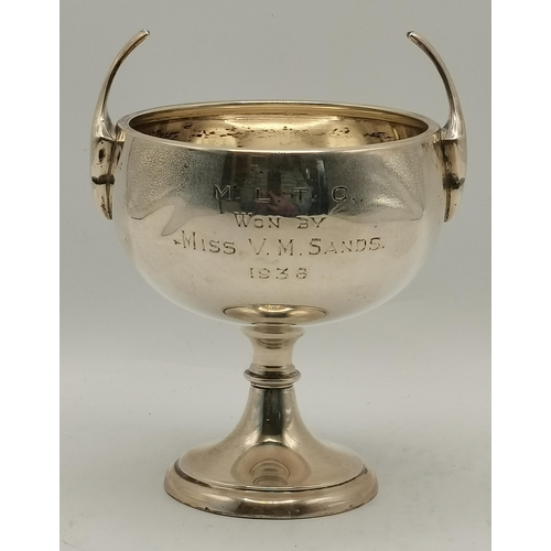 357 - A small group of mixed silver, 20th Century, comprising a George VI twin-handled trophy cup by Willi... 