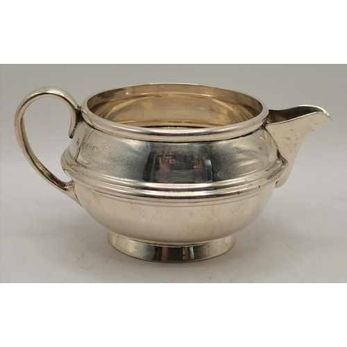 360 - An Edwardian silver twin-handled sugar bowl by William Neale & Son, Birmingham 1907, squat circular ... 