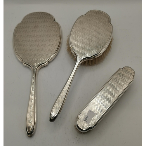 367 - An Elizabeth II silver dressing table brush and mirror set by Albert Carter, Birmingham 1972 and Lon... 