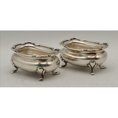 369 - A pair of George II open silver salts, maker's mark rubbed, London 1756, bellied circular with a sha... 