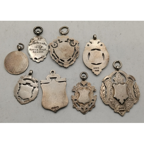 385 - Eight silver fob medals, various makers and dates, one with presentation inscription 'Whitby Regatta... 