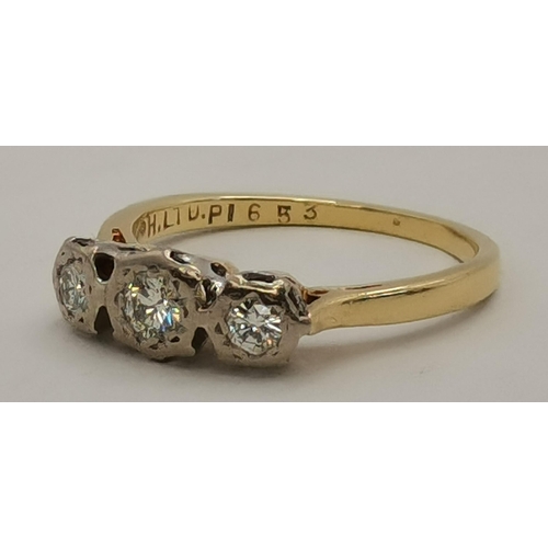 393 - An 18 carat gold three-stone diamond ring, the three graduated stones illusion-set in white gold, th... 