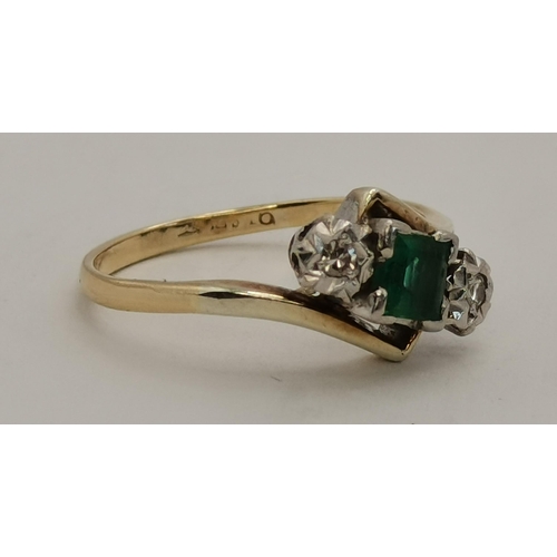 394 - A 9 carat gold and platinum emerald and diamond three-stone crossover ring, the square-cut emerald e... 