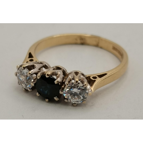 395 - A 9 carat gold sapphire and diamond three-stone ring, the stones to white metal claw settings, the s... 