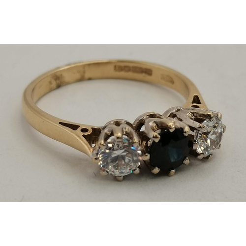 395 - A 9 carat gold sapphire and diamond three-stone ring, the stones to white metal claw settings, the s... 