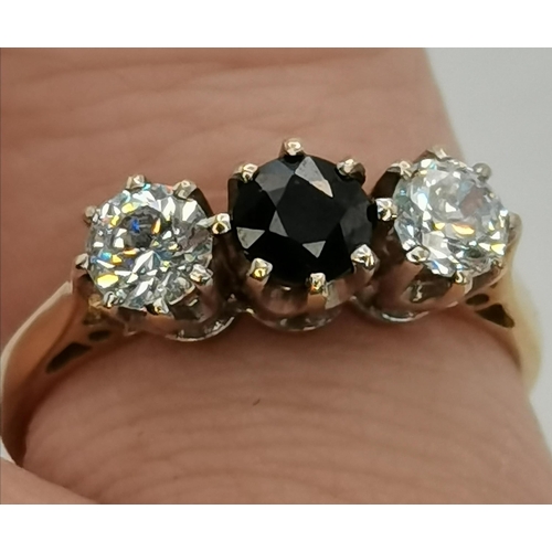 395 - A 9 carat gold sapphire and diamond three-stone ring, the stones to white metal claw settings, the s... 