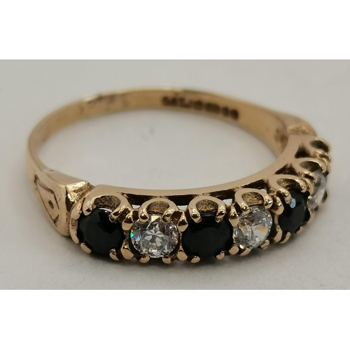 396 - A 9 carat gold sapphire and diamond seven-stone ring, the stones in claw settings, the shank hallmar... 