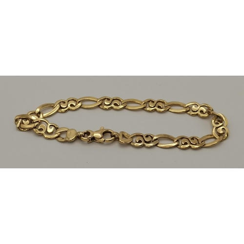 407 - A 9 carat gold fancy link bracelet, comprising scroll and oval links, stamped '375'. 19.5cm long, 8.... 