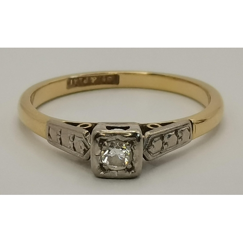 408 - An 18 carat gold and platinum solitaire diamond ring, the single white stone set in platinum with sc... 