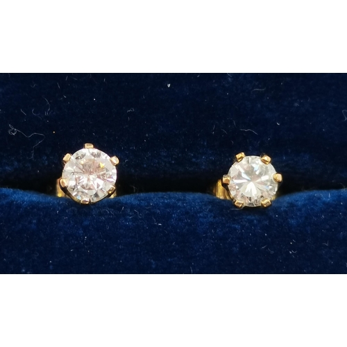 411 - Five pairs of stud earrings including a pair of 18 carat gold and white stone studs, stamped '750'; ... 