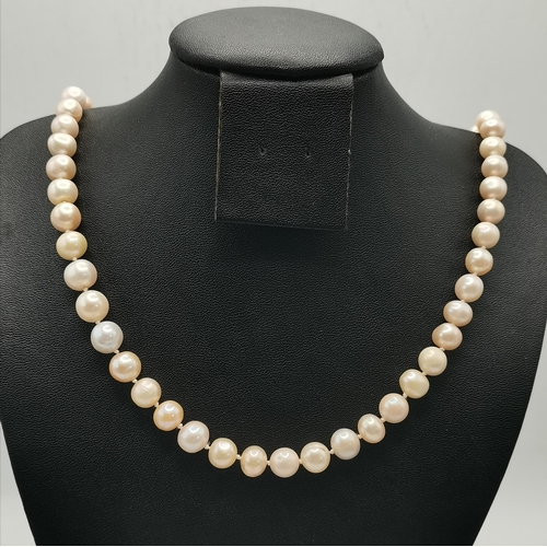 418A - A suite of yellow metal-mounted cultured pearl jewellery comprising a necklace (the clasp stamped '3... 