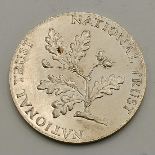 421 - Two commemorative medallions, comprising a silver 'National Trust' medallion, maker JRC, London 1976... 