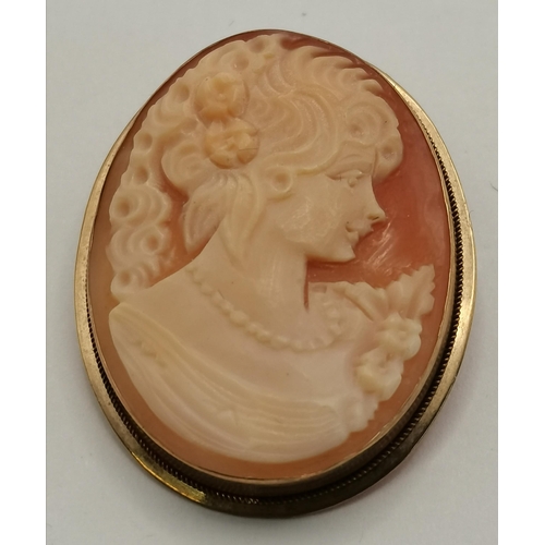 428 - Two Italian 9 carat gold mounted cameo brooches, the first oval with a female bust looking right, st... 