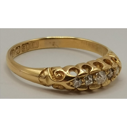 432 - An 18 carat gold five stone ring, hallmarked. Ring size L, 2.4g