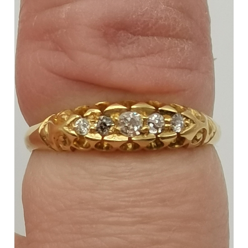 432 - An 18 carat gold five stone ring, hallmarked. Ring size L, 2.4g