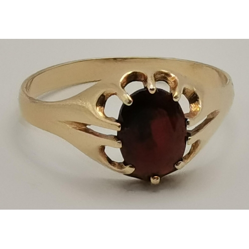 433 - A 9 carat gold garnet ring, a solitaire oval-cut garnet to a claw setting, hallmarked, ring size V; ... 