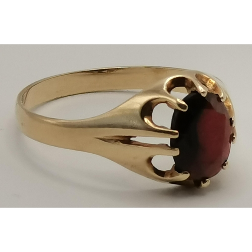 433 - A 9 carat gold garnet ring, a solitaire oval-cut garnet to a claw setting, hallmarked, ring size V; ... 