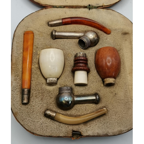 450E - A late 19th/early 20th Century interchangeable smoking pipe set, comprising five bowl attachments an... 