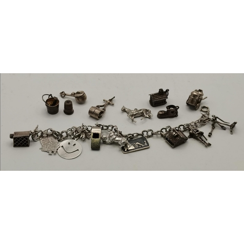 450F - A silver charm bracelet with heart padlock clasp, the clasp stamped 'SS', the links stamped with a l... 