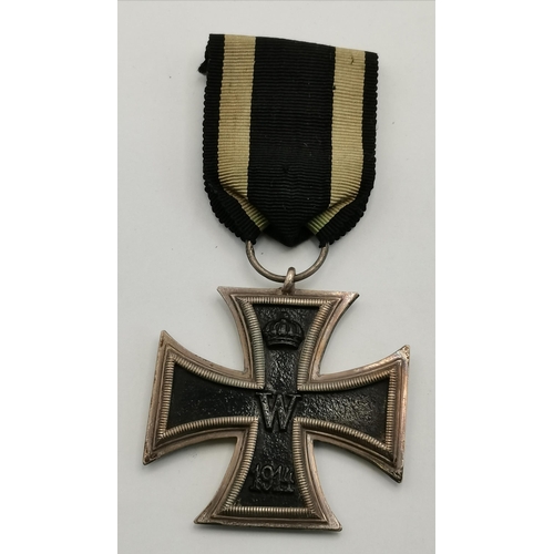 462 - A World War I Iron Cross, Second Class, 1914, with ribbon; together with a World War I Croix de Guer... 