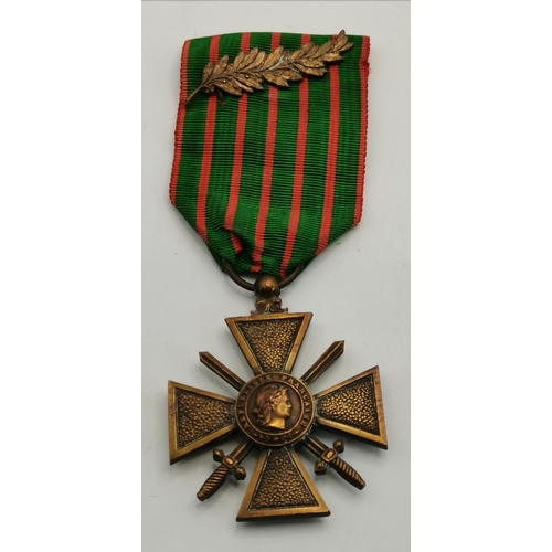 462 - A World War I Iron Cross, Second Class, 1914, with ribbon; together with a World War I Croix de Guer... 