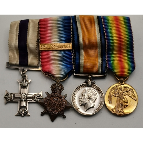 464 - A First World War Military Cross and set of miniatures comprising MC, a 1914 Star with 5th Aug-22nd ... 