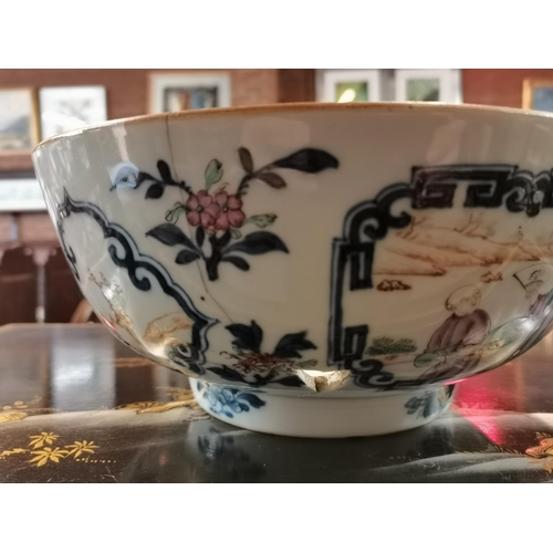 519 - An early Chinese bowl with decorative floral and characters. 27cm diameter