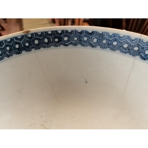 519 - An early Chinese bowl with decorative floral and characters. 27cm diameter