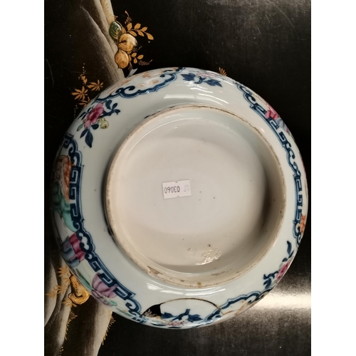 519 - An early Chinese bowl with decorative floral and characters. 27cm diameter