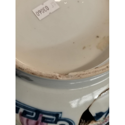 519 - An early Chinese bowl with decorative floral and characters. 27cm diameter