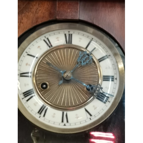 525 - A Vienna wall clock with decorative finials and horse decoration