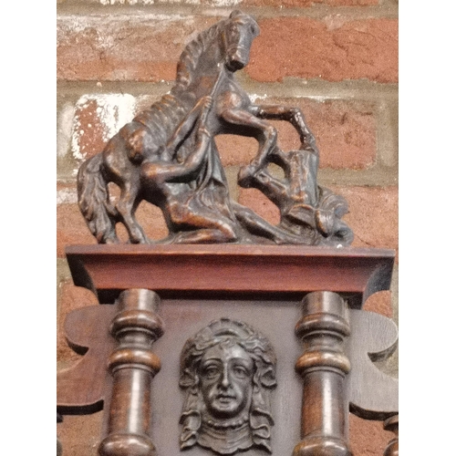 525 - A Vienna wall clock with decorative finials and horse decoration