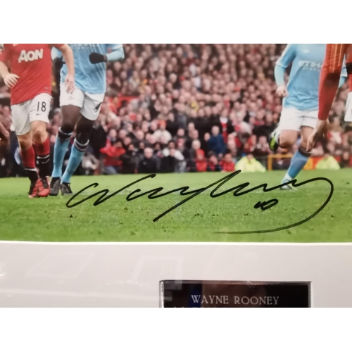 549 - A signed coloured photo of WAYNE ROONEY A GOAL TO REMEMBER.
MANCHESTER UTD V Manchester City 12TH FE... 