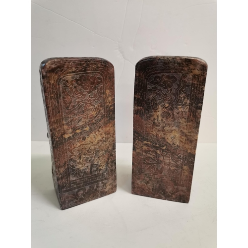 564b - A good pair of CHINESE soapstone/ granite carved stands, 19cm high .Highly decorated with an ox and ... 