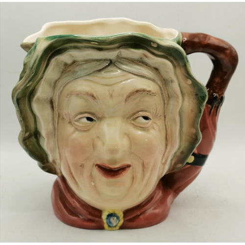 595 - A collection of Royal Doulton character / toby jugs plus others .