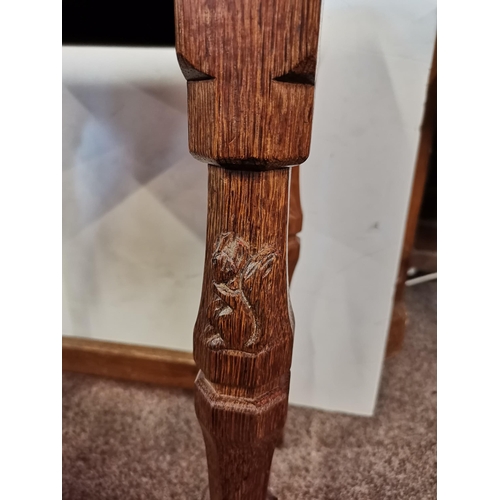 611A - Wilfred Hutchinson, a Squirrelman oak stool, the adzed dished top raised on faceted baluster legs te... 