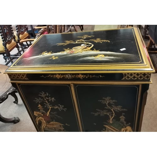 661 - A Chinese style black lacquer drinks cabinet with highly decorative floral detail, female figures, p... 