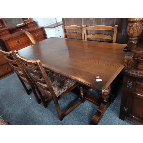 842 - A 20th century oak court cupboard, dining table and 4 chairs