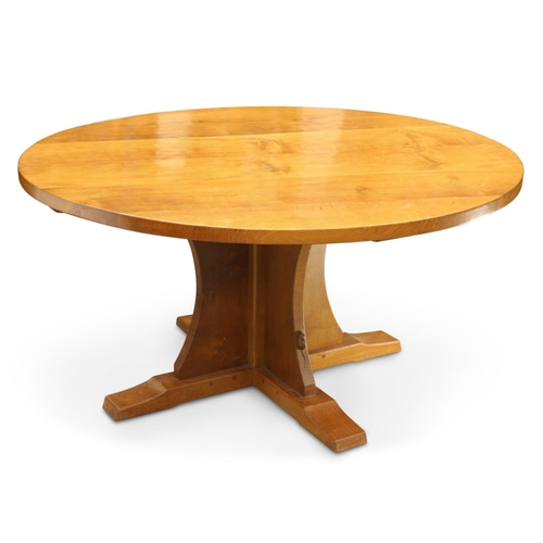 654 - Robert Thompson, a Mouseman circular dining table, lightly adzed, raised on a cruciform base on slei... 