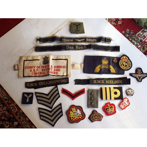 481 - A collection of military badges and cloth insignia, both British and Foreign. Also a selection of Br... 